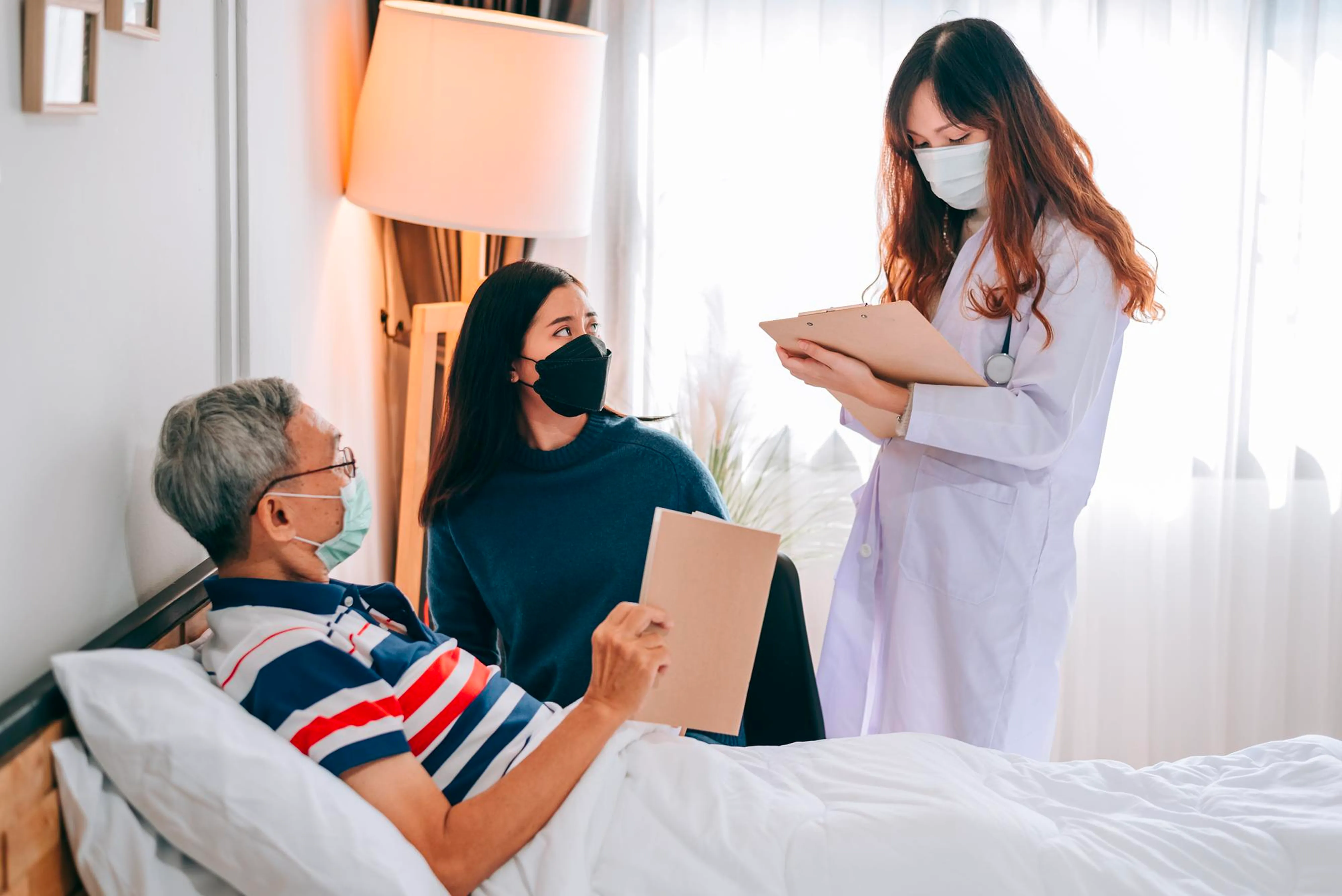 A doctor talking with a patient and a family